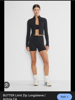 Aritzia butter zip up black with gold detailing